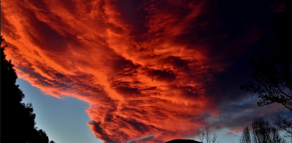 red clouds, low clouds, sunset poem